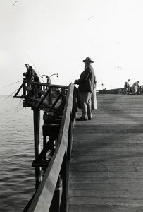 People fishing off the Pleasure Pier, 1960s
