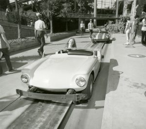 A young driver enjoying a spin on the Autorama, 1981