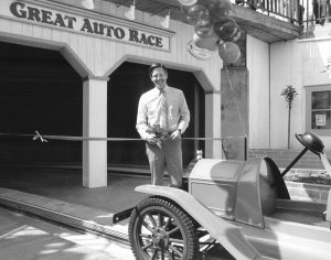 Seaside Company President Charles Canfield cutting the ribbon for the Great Auto Race, 1985