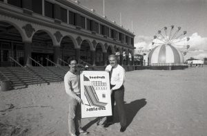 Ed Hutton (right) with the 75th Anniversary poster artist, Jay Collins, 1982