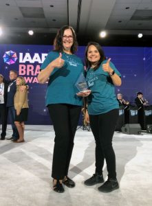 Susan Teague and Jessica Alfaro at the IAAPA Convention accepting the Brass Ring Award for the Boardwalk's Best Program