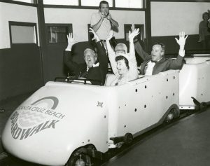 Santa Cruz Mayor and Seaside Company President riding the Giant Dipper