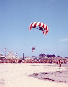 Skydiver landing on Main Beach, 1972