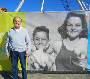 Fred Quadros in 2016 next to the photo of him from his Water Carnival days