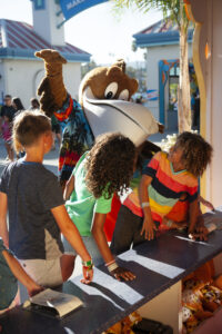 Splash behind kids playing ring toss