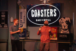 Two people performing karaoke