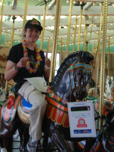 Nicholas Laschkewitsch riding the Carousel 100 times for its 100th anniversary.
