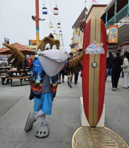 Splash posing with the Guest of the Day surfboard.